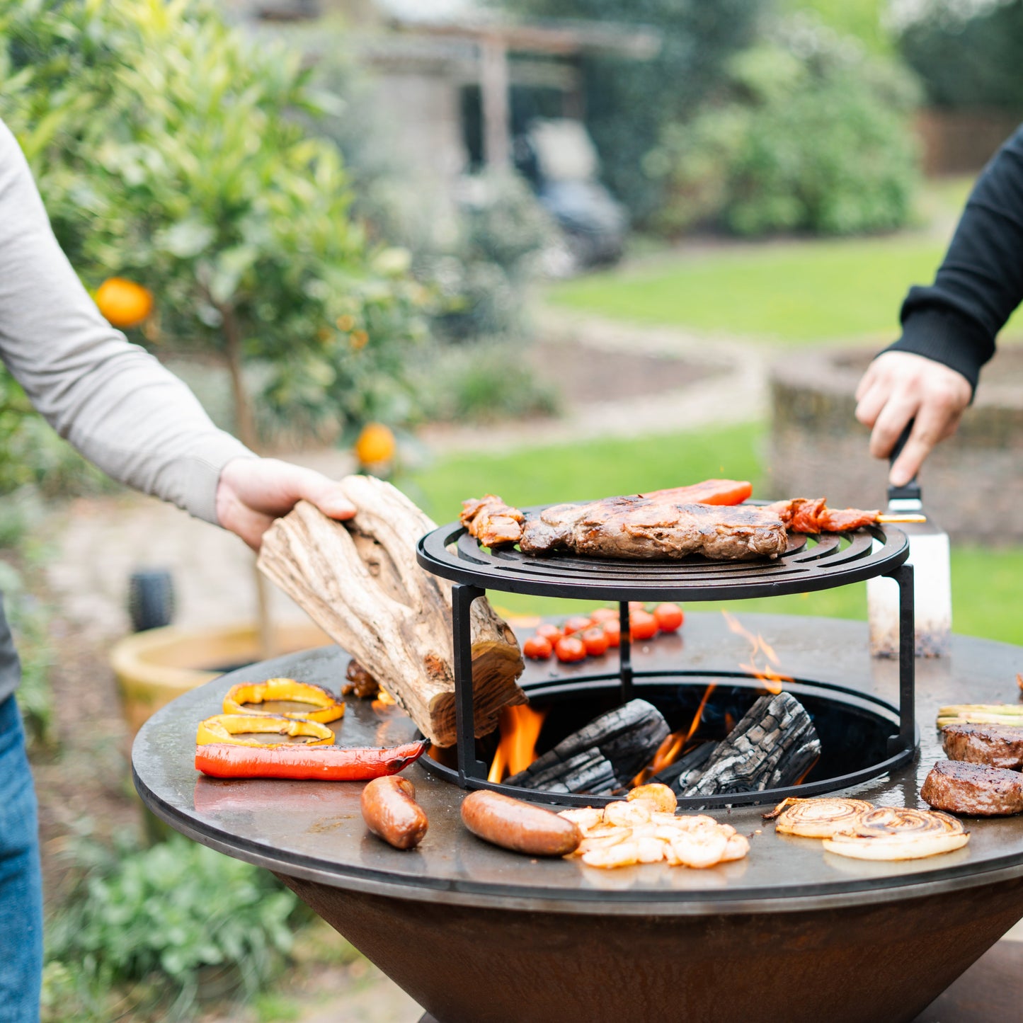 BBQ Plancha Grill Compañero XXL Corten steel - With poker and wood storage Ø80cm