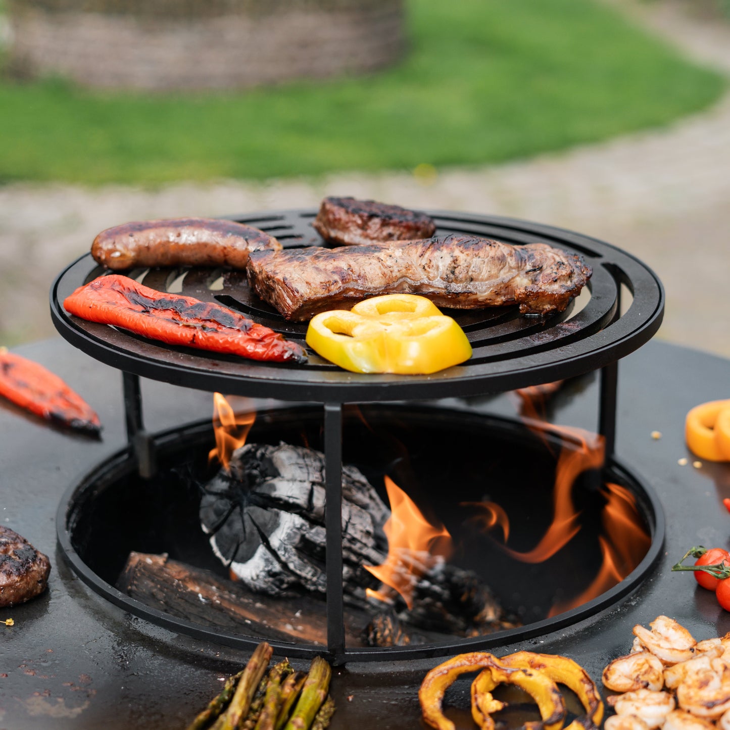 BBQ Plancha Grill Compañero XXL Blackline - With poker and wood storage Ø80cm