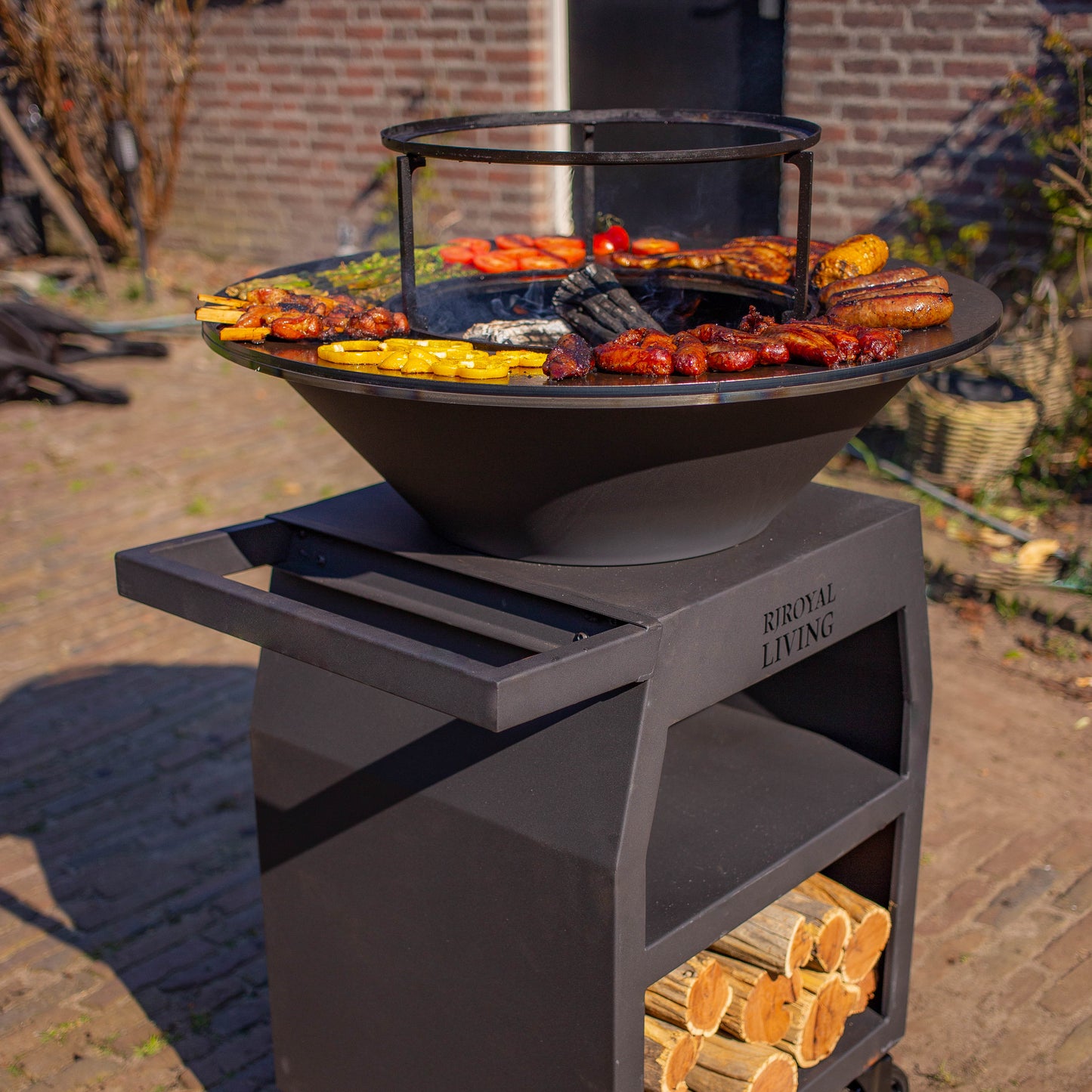 BBQ Plancha Grill Maestro Ø70cm Blackline - With large wheels and wood storage