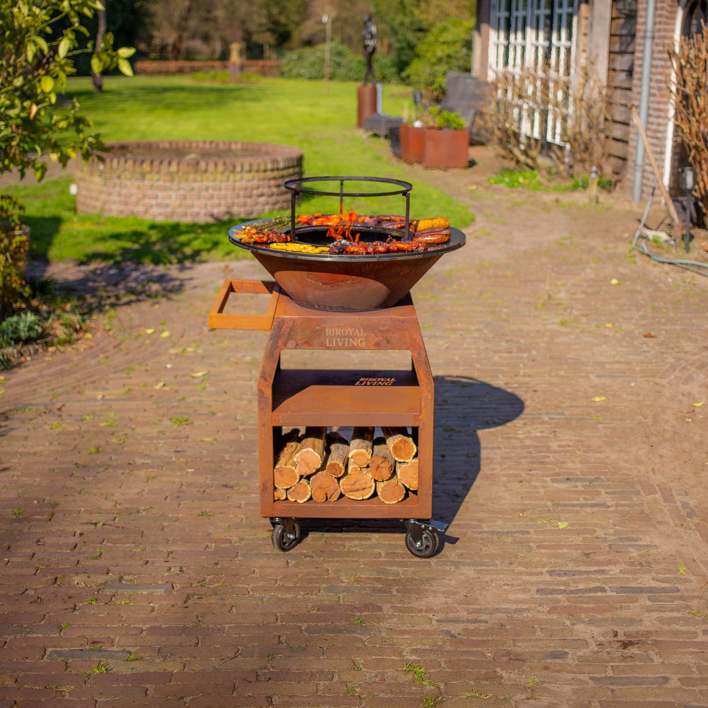 BBQ Plancha Grill Maestro Ø70cm Corten steel - With large wheels and wood storage