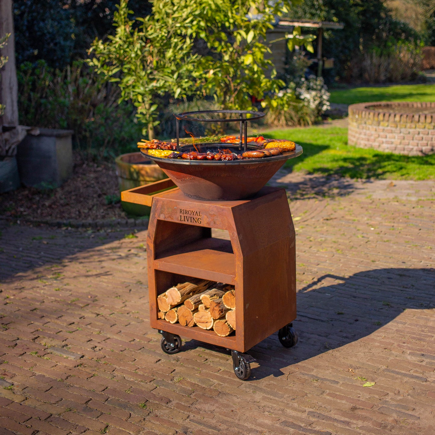 BBQ Plancha Grill Maestro Ø70cm Corten steel - With large wheels and wood storage